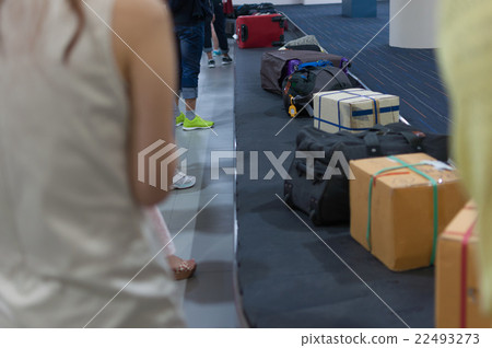Line of luggage and belonging and people Line of luggage and belonging and people 22493273