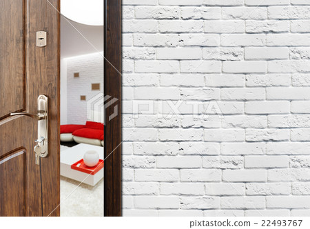 Half open door of a modern living room closeup. 22493767