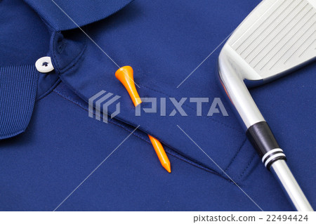 Blue polo shirt and golf equipments 22494424