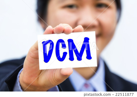 Businesswoman holding card with DCM message. Businesswoman holding card with DCM message. 22511877