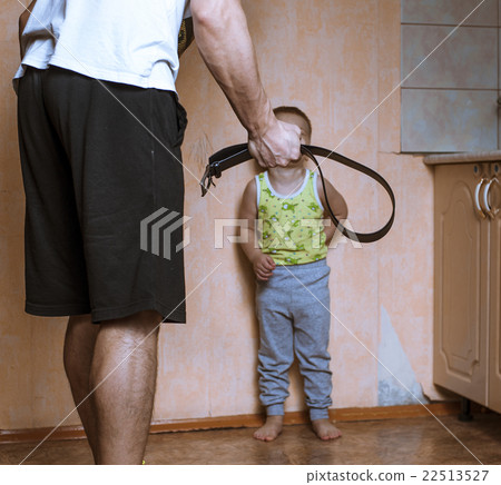 Angry father with belt and scared child 22513527