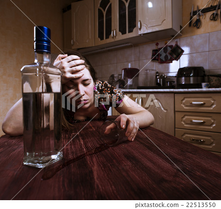 Portrait of drunk woman with inverted glass Portrait of drunk woman with inverted glass 22513550