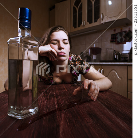 Drunk woman falling asleep with glass of alcoholic drink Drunk woman falling asleep with glass of alcoholic drink 22513551