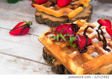 Belgium waffles with strawberries and chocolate. Belgium waffles with strawberries and chocolate. 22515882