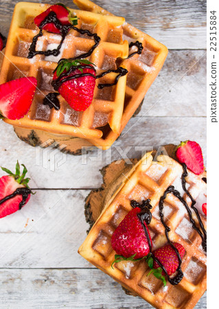 Belgium waffles with strawberries and chocolate. Belgium waffles with strawberries and chocolate. 22515884