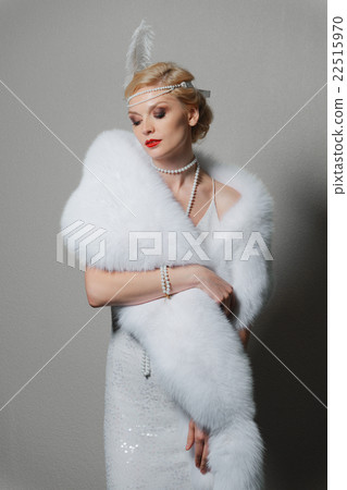 woman in white dress with shoulder straps and long fur stole woman in white dress with shoulder straps and long fur stole 22515970