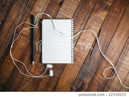 Notepad, pencil and headphones Notepad, pencil and headphones 22516015