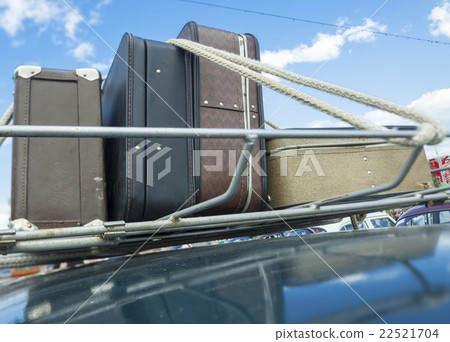 suitcases roof  car. 22521704