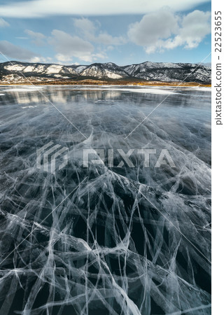 Ice lake with cracks. 22523655