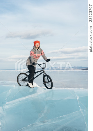Girl on a bmx on ice. Girl on a bmx on ice. 22523707