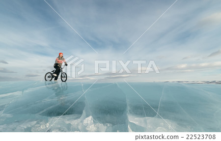 Girl on a bmx on ice. Girl on a bmx on ice. 22523708