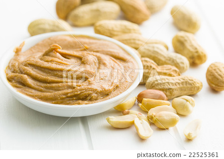 Creamy peanut butter and peanuts. 22525361