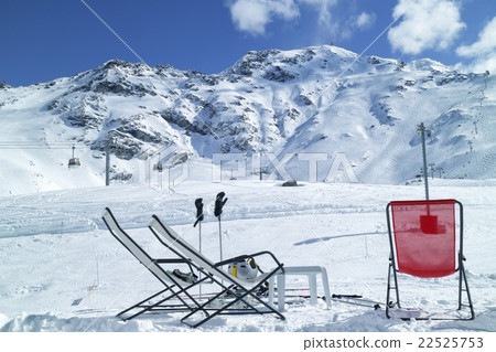 Chairs apres ski high Alps mountain winter resort 22525753