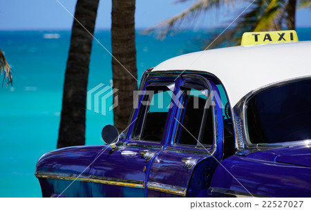 oldtimer taxi car is parking w palms at the sea oldtimer taxi car is parking w palms at the sea 22527027