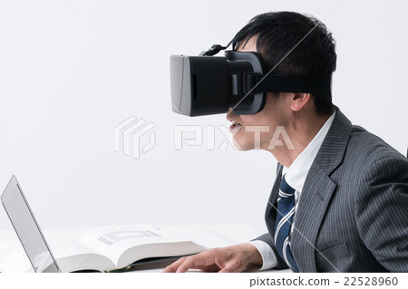 Male with VR / head mounted display Male with VR / head mounted display 22528960