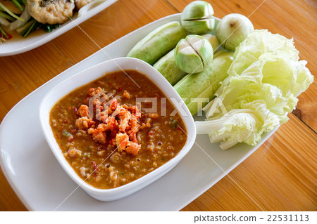 Spicy crab roe chili sauce served with vegetable Spicy crab roe chili sauce served with vegetable 22531113
