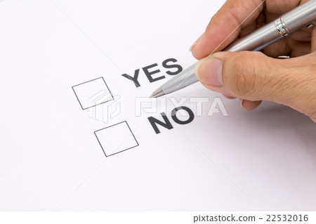 Man hand with pen over document, select Yes or No. 22532016