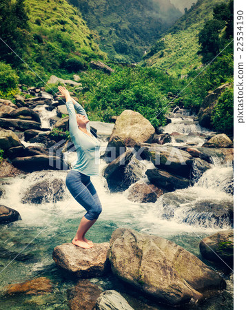 Sorty fit woman doing yoga asana Utkatasana Sorty fit woman doing yoga asana Utkatasana 22534190