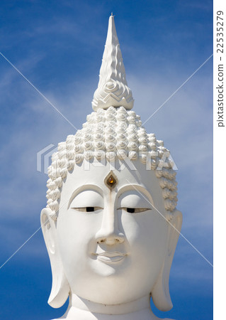 head of white buddha against blue sky head of white buddha against blue sky 22535279