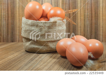 Eggs in basket on wood.eggs.egg.brown.rawfood Eggs in basket on wood.eggs.egg.brown.rawfood 22535449