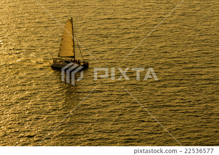 Sailing yacht boat on golden tropical sea. Sailing yacht boat on golden tropical sea. 22536577