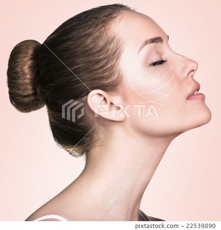 Portrait of woman with arrows on her face Portrait of woman with arrows on her face 22539890