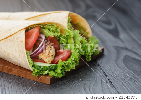 pair of fresh juicy wrap sandwiches with chicken 22543773
