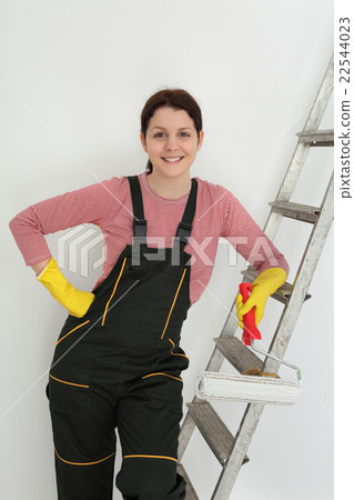 Young smiling worker paint a room Young smiling worker paint a room 22544023