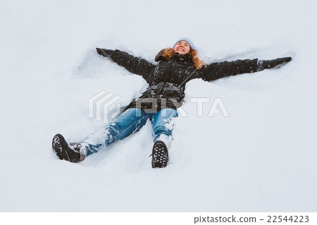 Portrait of a beautiful young woman laying down Portrait of a beautiful young woman laying down 22544223