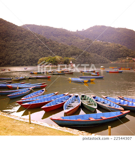 Blue boats on the lake  - vintage effect. 22544307