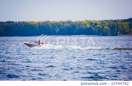Speed motor boat on azure lake Speed motor boat on azure lake 22544762