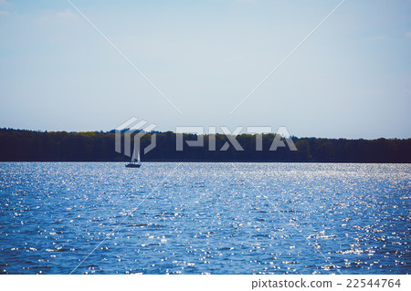 sailing motor boat on azure lake 22544764