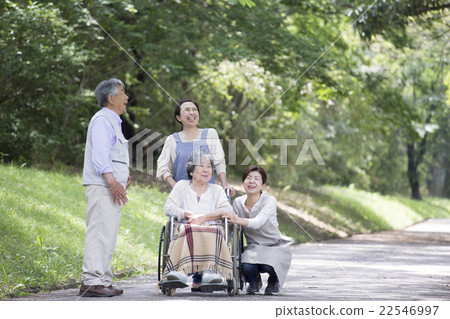Seniors and helpers in wheelchairs 22546997