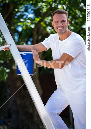 Painter with stepladder and bucket Painter with stepladder and bucket 22550848