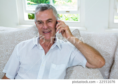 Portrait of happy senior man talking on mobile phone Portrait of happy senior man talking on mobile phone 22551076
