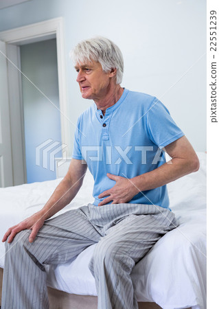 Senior man suffering from stomach pain Senior man suffering from stomach pain 22551239