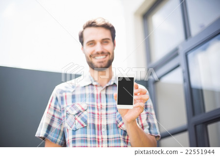 Happy man holding mobile phone Happy man holding mobile phone 22551944