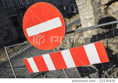 Round red sign No Entry on urban road barrier 22556426
