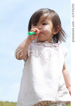 Infant playing with soap bubble (1 year old child) 22558292