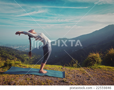 Woman doing yoga Sun salutation Surya Namaskar Woman doing yoga Sun salutation Surya Namaskar 22559846