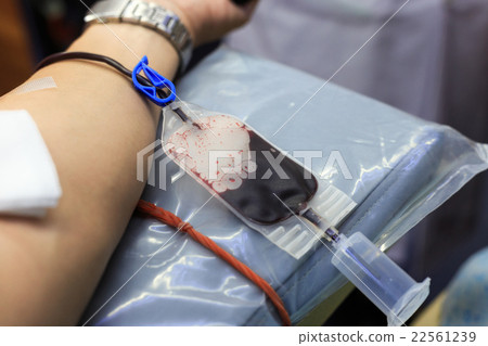 A man getting a transfusion as a blood donor A man getting a transfusion as a blood donor 22561239