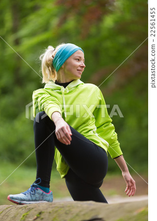 Sporty woman working out in forest. Sporty woman working out in forest. 22561455