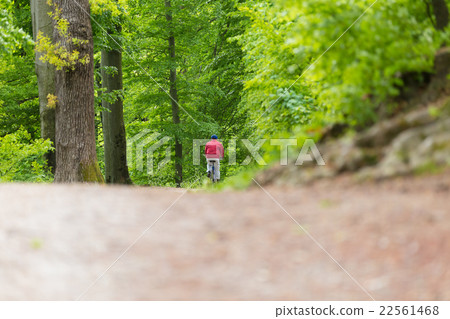 Cyclist Riding Bycicle on Forest Trail. 22561468