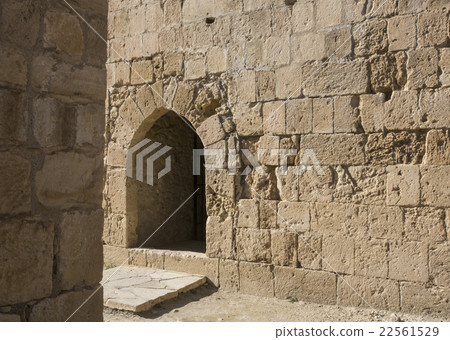 Arch window in old stone wall Arch window in old stone wall 22561529