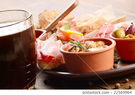 Tapas of salmon mussels jamon and olives with beer Tapas of salmon mussels jamon and olives with beer 22569964