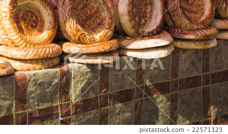 Kirghiz bread tokoch on market in Osh. Kyrgyzstan. Kirghiz bread tokoch on market in Osh. Kyrgyzstan. 22571323