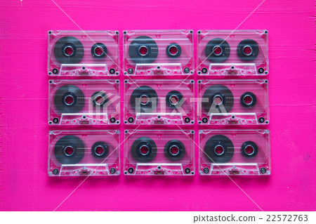 Set of old audio cassettes on wooden table. 22572763