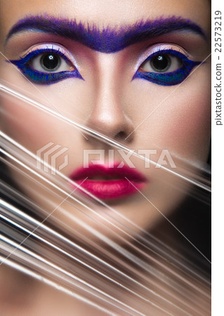 Fashion model with makeup art ,solid eyebrow.  22573219