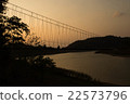 Silhouette rope bridge in the evening 22573796