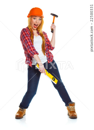 Young woman worker in helmet with the work tools on a white 22580331